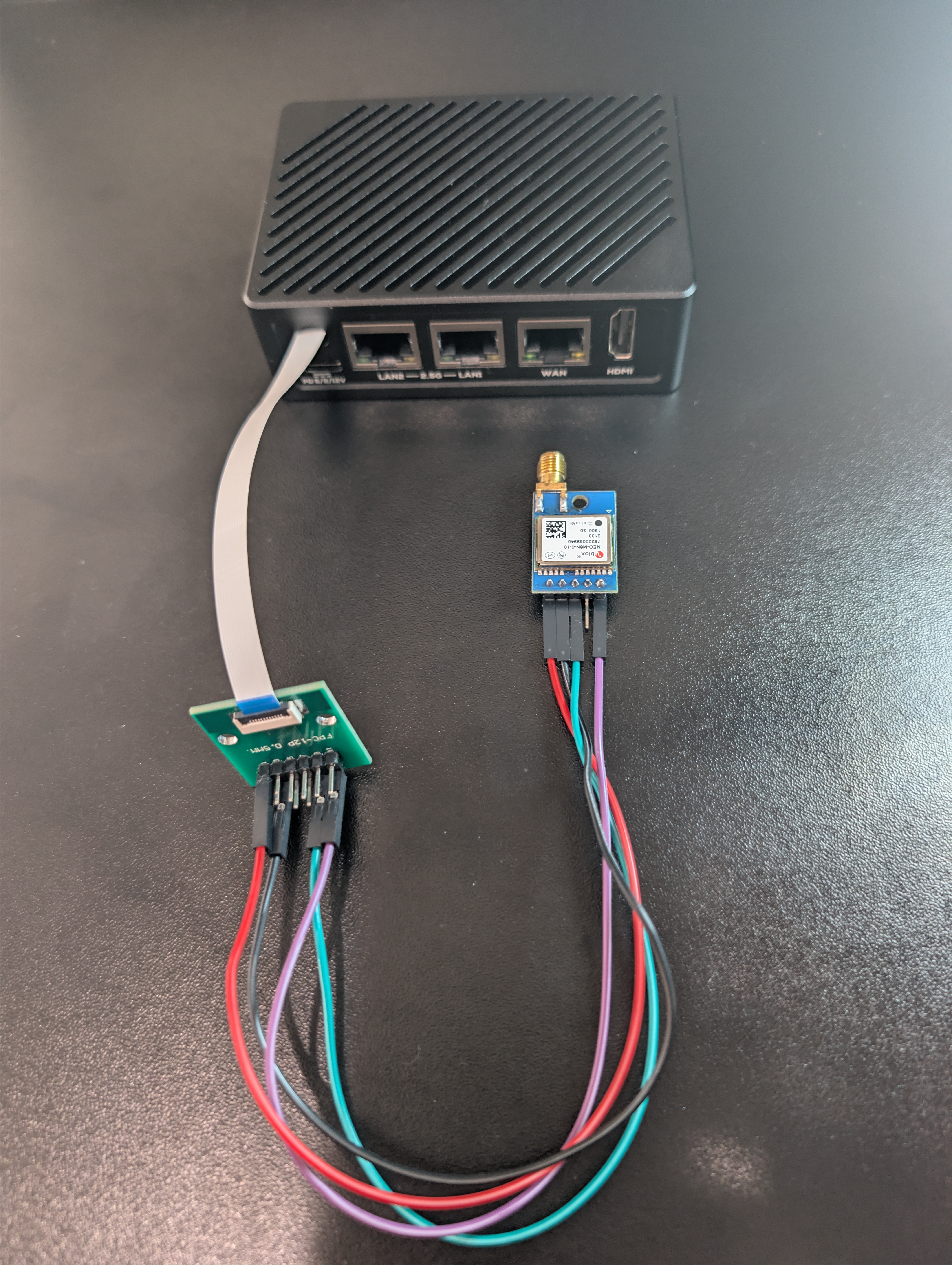 Assembled NanoPi R5S-LTS in case with GPS module and FPC breakout board connected externally